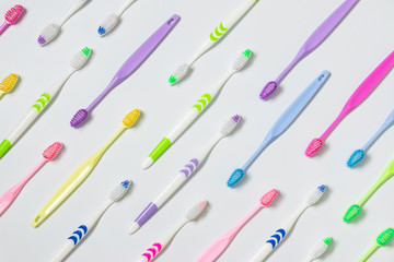 Top view,flat lay of toothbrushes in colorful on white background.