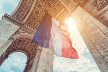 french flag at arc de triomphe during bastille day - obrazy, fototapety, plakaty