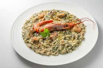 Risotto dish with prawns and seafood and parsley