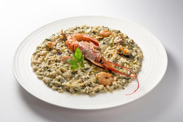 Risotto dish with prawns and seafood and parsley