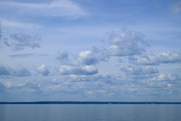 background white fluffy clouds high in the sky