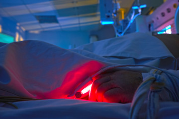 Glowing monitors in intensive care department. Nigth shift at icu, patient in critical state.