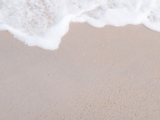 sand of beach and soft wave background 