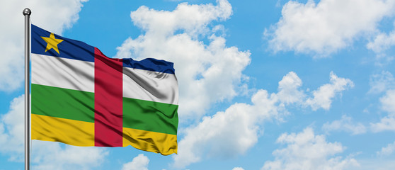 Central African Republic flag waving in the wind against white cloudy blue sky. Diplomacy concept, international relations.