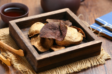 chinese dried tangerine peel in wooden box with tea