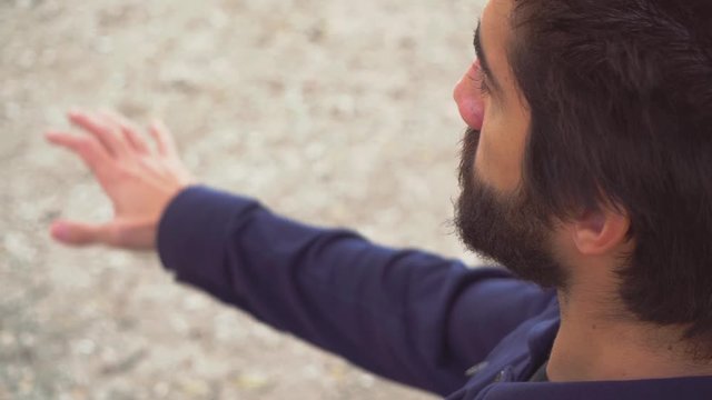 Man waving his hand in the air imagining that he presses the keys