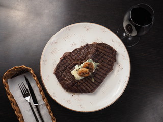 Juicy delicious sirloin steak with grilled shrimps