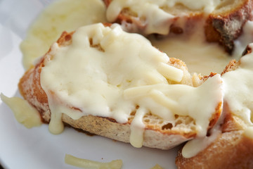Baguette slice with melting cheese
