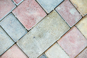 Stone pavement texture. Granite cobblestoned pavement background. Abstract background of old cobblestone pavement close-up