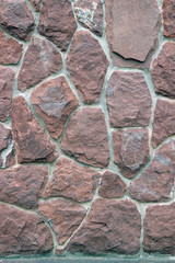 The texture of a wall of large stones close-up