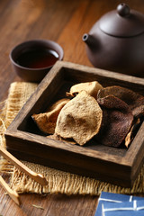 chinese dried tangerine peel in wooden box with tea