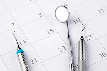 Reminder dentist appointment in calendar and professional dental tools.- Image © AVC Photo Studio