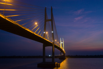 Fototapeta na wymiar Neak Loeung bridge at PhnomPenh - Cambodia on sunset , this is a longest bridge at Cambodia