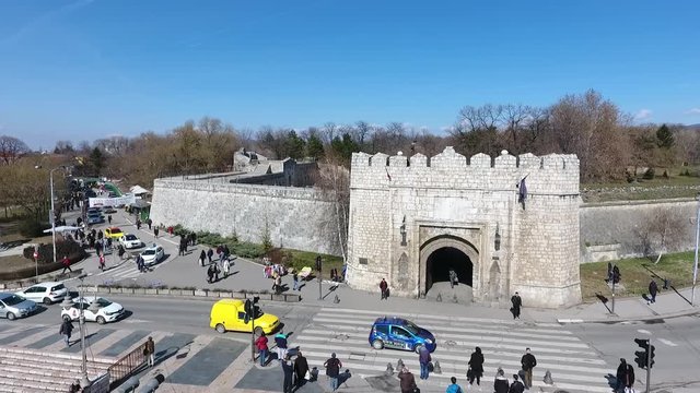 Aerial view from above of old Serbian city Nis fortress in Serbia built by Romans and Turks with car driving in traffic and people walking