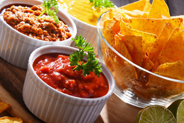 Composition with bowl of potato chips.