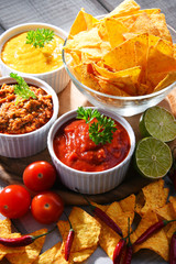 Composition with bowl of potato chips.