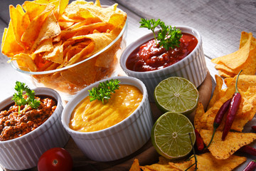 Composition with bowl of potato chips.