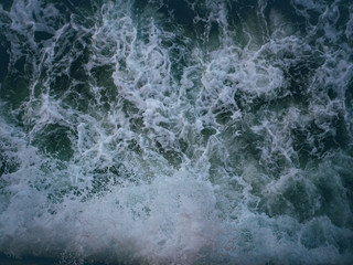 Tidal waves crashing against a wall