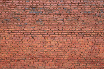 Naklejka premium Image of old red brick wall with texture background, copy space for advertisment or promotion text, wide panorama of masonry, vintage house facade with ruined elements, may use to interior designer.