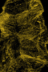 Transparent yellow plastic wrap on the black background. Plastic shopping bag texture. Reusable trash and waste.