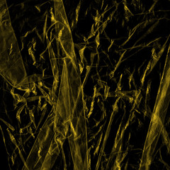 Transparent yellow plastic wrap on the black background. Plastic shopping bag texture. Reusable trash and waste.