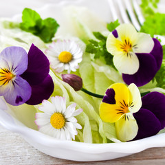 Fresh salad with various eatable flowers