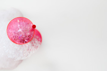 soap bubbles on a glass on white background