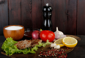ingredients for burger on wooden background