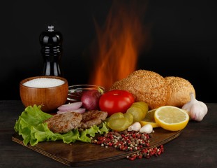 ingredients for burger on wooden background