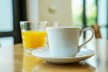 cup of coffee on wooden table