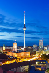 Fototapeta na wymiar Berlin skyline tv tower downtown portrait format townhall at night Germany city