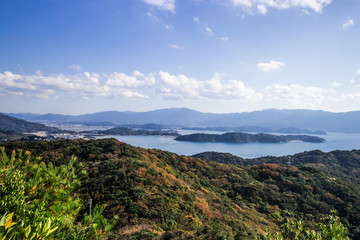 Naklejka na ściany i meble Landscape of Itoshima from mountain in Itoshima, Fukuoka, Japan. In image, there are small islands in the sea of Genkai.