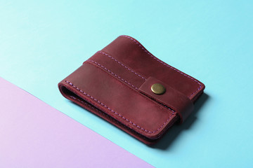 Leather wallet on color background. Stylish accessory