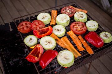 Grill party in a garden.  Healthy food preparing outdoors on summer or spring picnic.