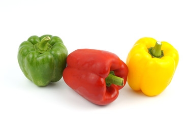 Fresh vegetables Three sweet Red, Yellow, Green Peppers on white background