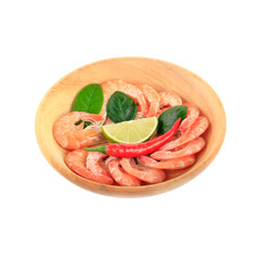 shrimps with spices in wooden plate isolated on white background