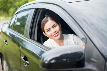 Beautiful woman is driving her car