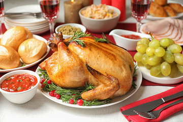 Traditional festive dinner with delicious roasted turkey served on table