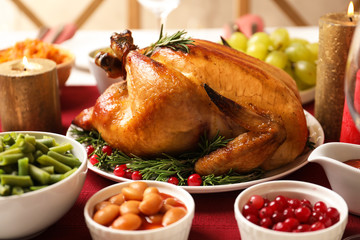 Traditional festive dinner with delicious roasted turkey served on table