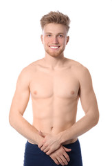 Fototapeta premium Portrait of young man with slim body on white background