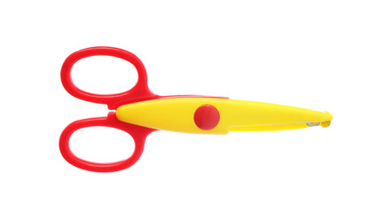 Pair of plastic scissors on white background