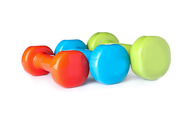 Color dumbbells on white background. Home fitness