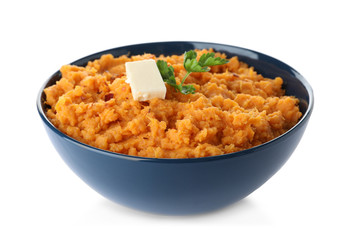 Bowl with mashed sweet potatoes on white background