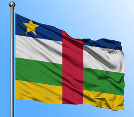 Central African Republic flag waving in the deep blue sky background. Isolated national flag. Macro view shot.