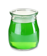Tasty colorful jelly in glass jar on white background
