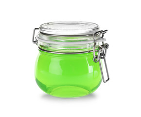 Tasty colorful jelly in glass jar on white background
