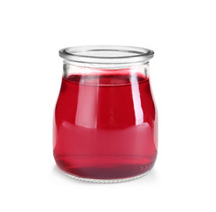 Tasty colorful jelly in glass jar on white background