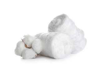 Fototapeta na wymiar Fluffy cotton rolls and flower on white background