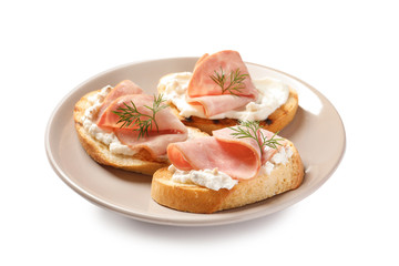 Plate of tasty bruschettas with ham on white background