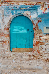 Very old door of a facade in ruins